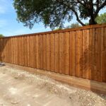 6 ft board on board with automatic driveway gate and retaining wall in duncanville texas