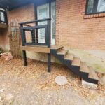 composite stairs with wood rail and metal rail