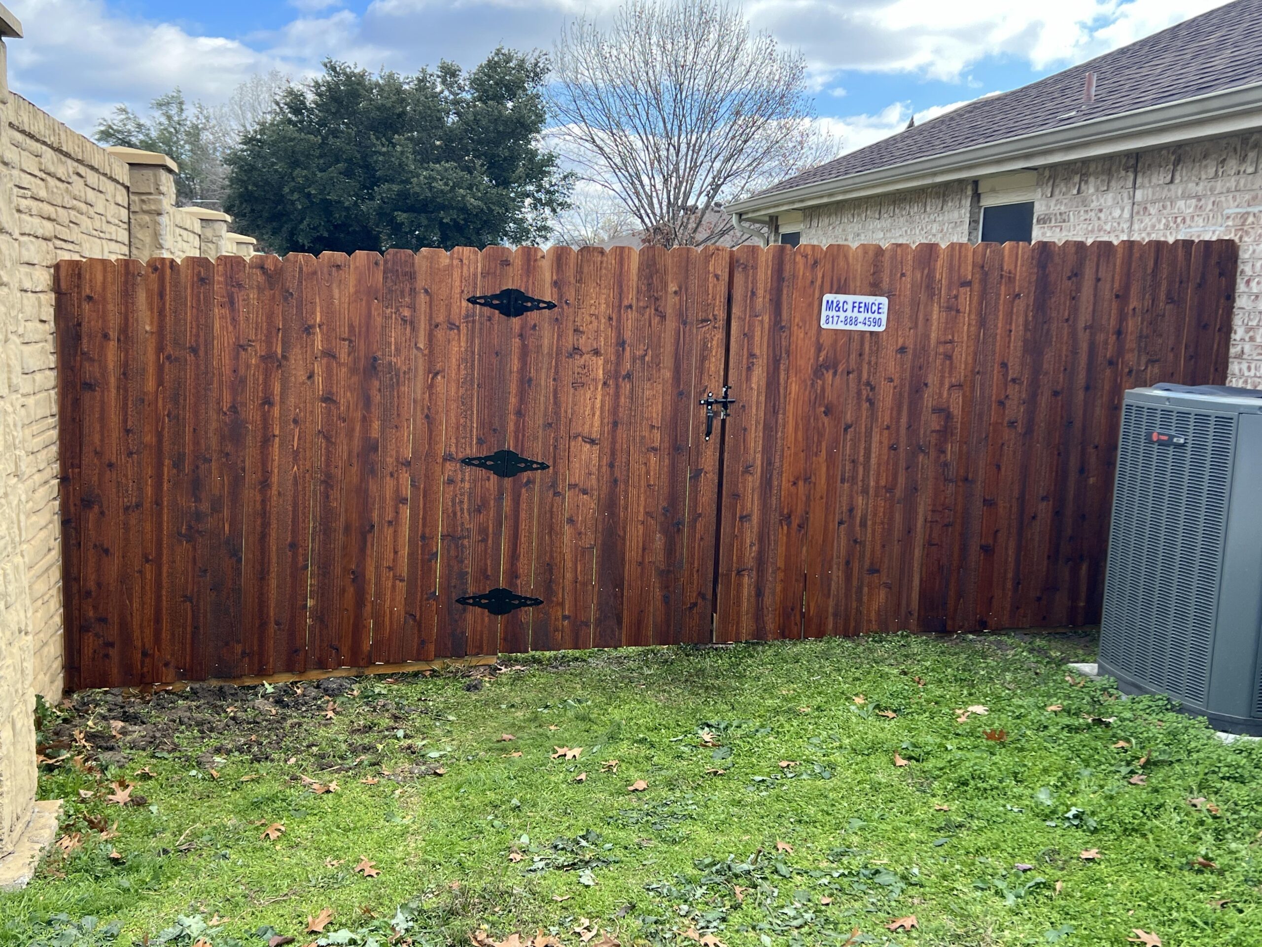 stained wood fence built by fence contractor m&c fence