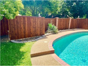 wood fence around a pool in arlington texas