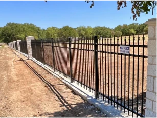 wrought iron and stone fence in irving texas